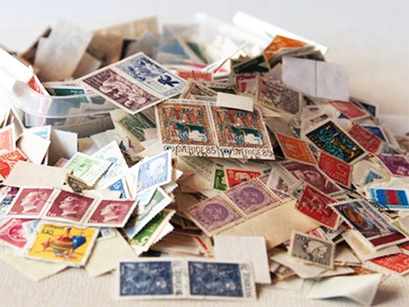 A box filled with old postage stamps